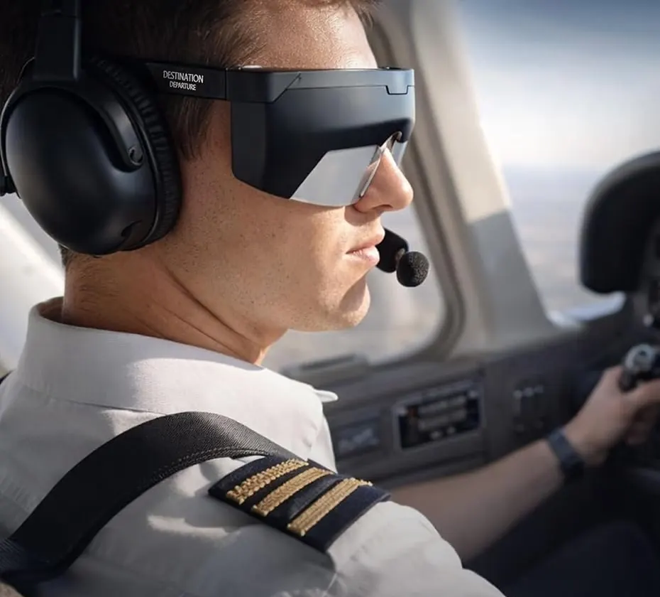 Pilot wearing black foggles under an aviation headset